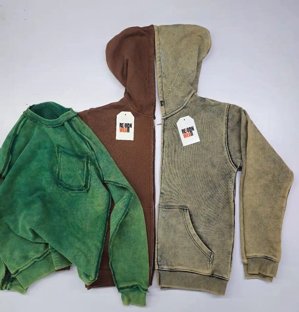 Custom fleece hoodies in brown, grey and green with private label branding by RebornWear