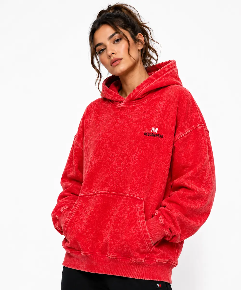 Custom women's hoodie in red acid wash finish — private label manufacturer RebornWear, Sialkot Pakistan