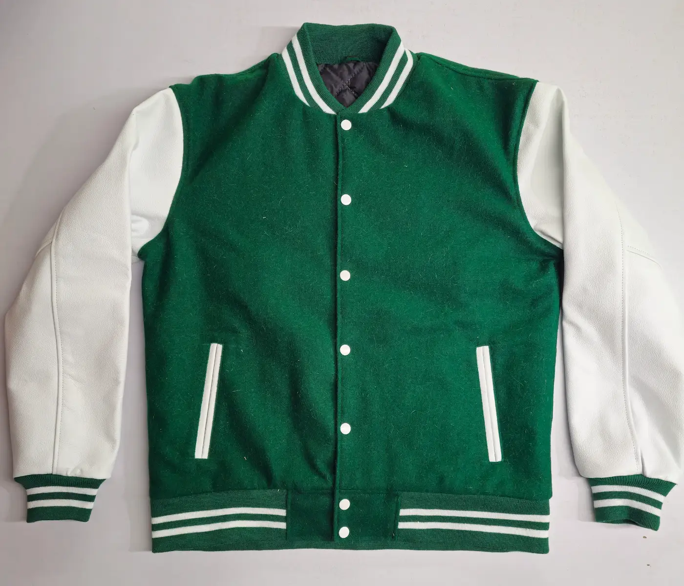 Custom varsity jackets manufacturer — private label production by RebornWear in Sialkot, Pakistan