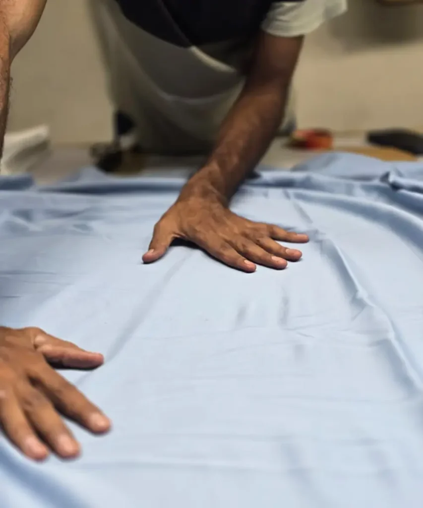 Why New Brands Choose RebornWear as Their Manufacturing Partner 5 fabric inspection during private label apparel production